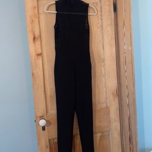 Black strapless jumpsuit, high neck, lace top. Worn once, excellent condition.